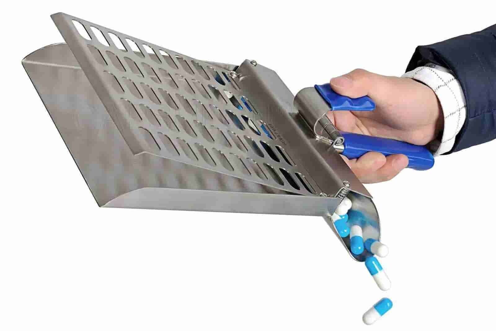 releasing tablets into the chute